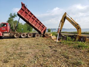 Dump truck and Excavator at work.